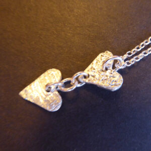 Twin heart pendant